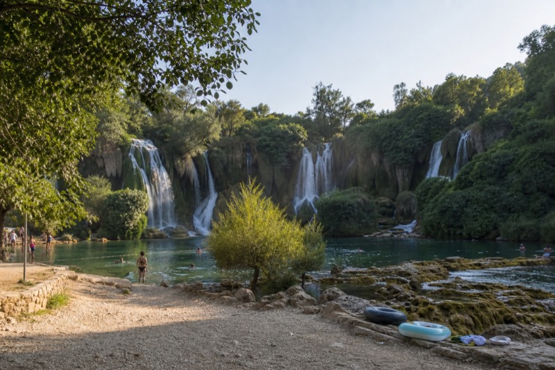 Late afternoon at Kravica Waterfalls in Bosnia, a swimming stop on a full day trip from Dubrovnik in Croatia