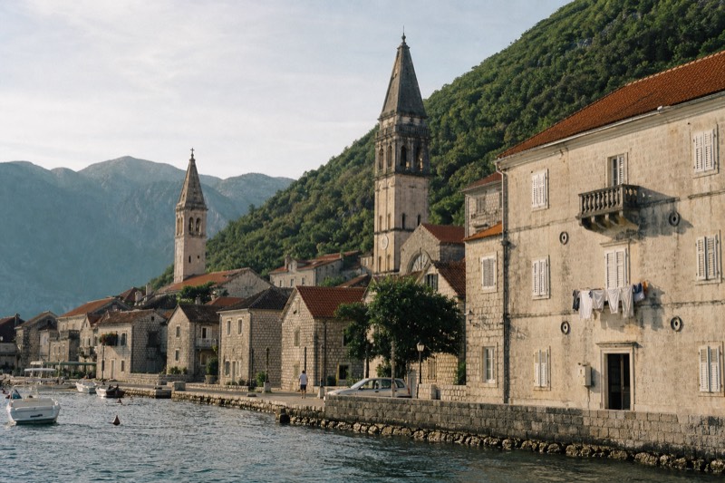 Afternoon light raking across Perast on the Bay of Kotor in Montenegro, a stop on a long day trip from Dubrovnik, Croatia
