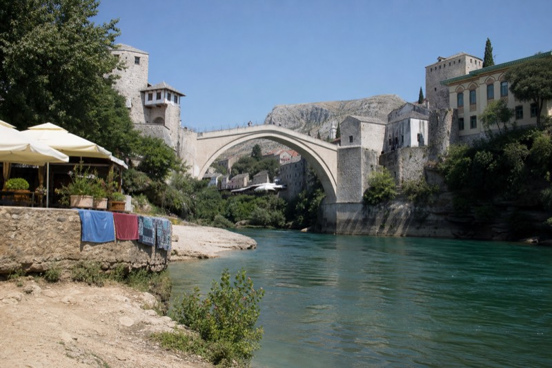 Midday heat over Mostar's rebuilt Ottoman bridge in Bosnia, a long day tour from Dubrovnik in Croatia