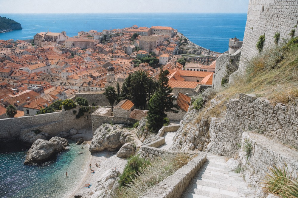 Wide view of Dubrovnik Old Town rooftops and the Adriatic Sea from the city walls