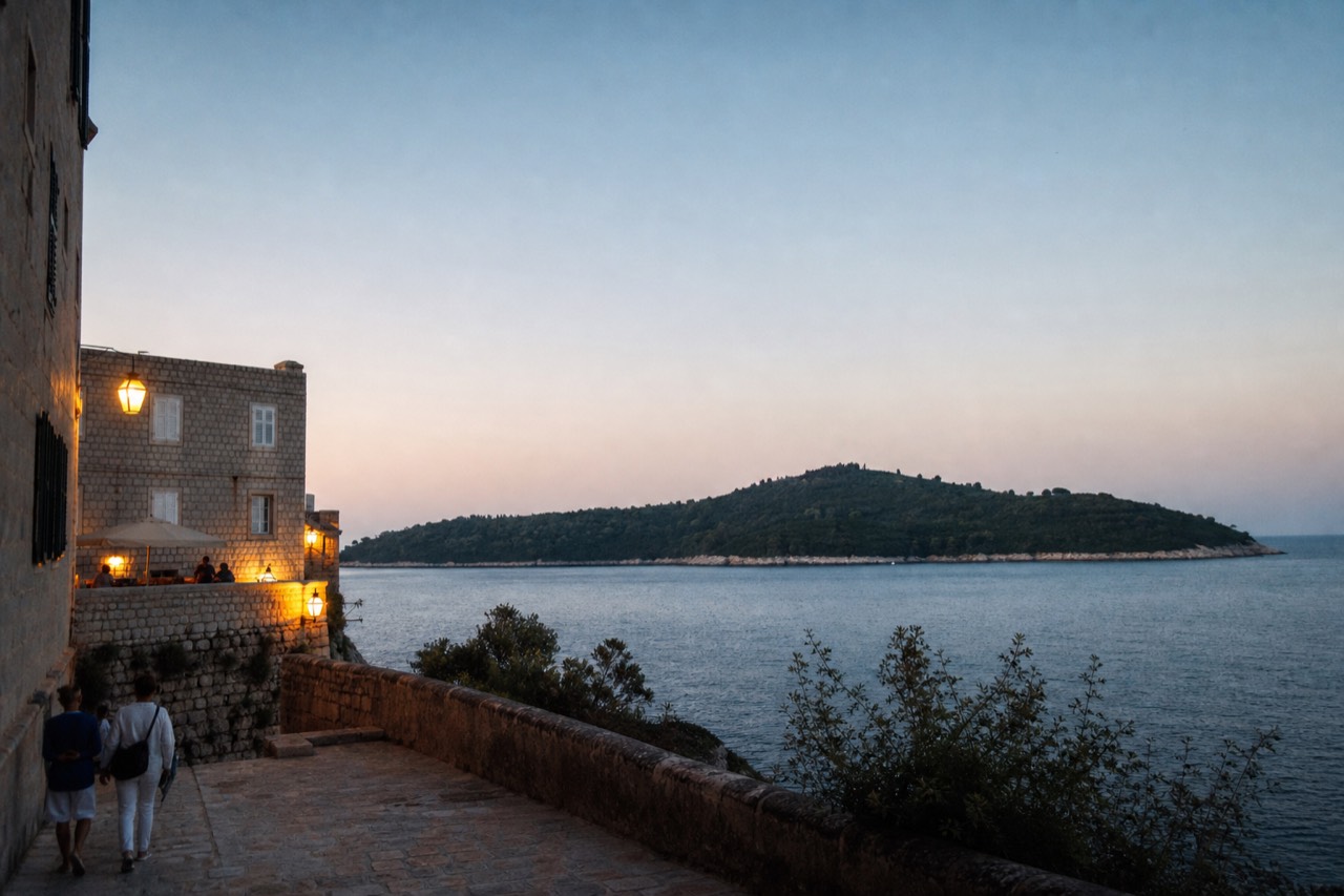 Wooded Lokrum island seen across calm water from the Dubrovnik coast