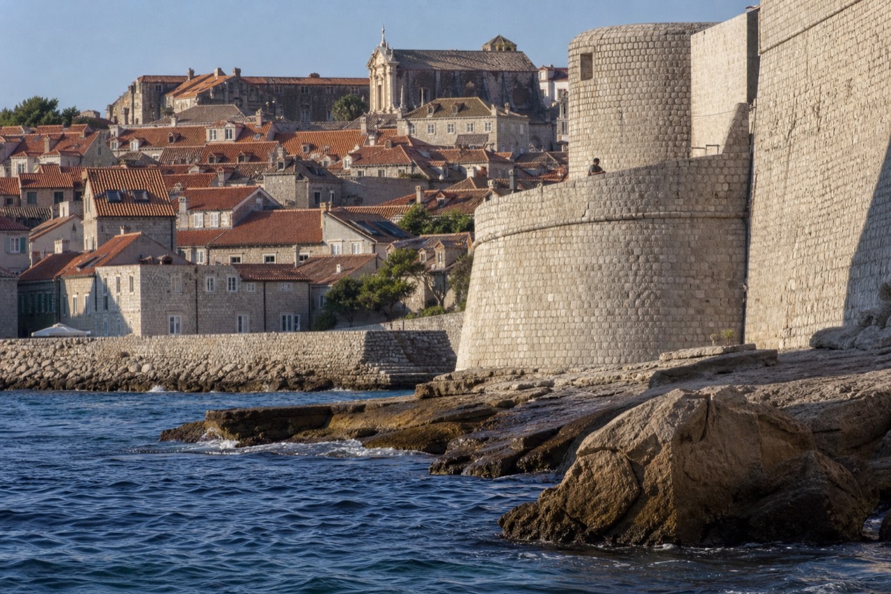 Stone rooftops of Dubrovnik Old Town seen from the city walls above the Adriatic sea