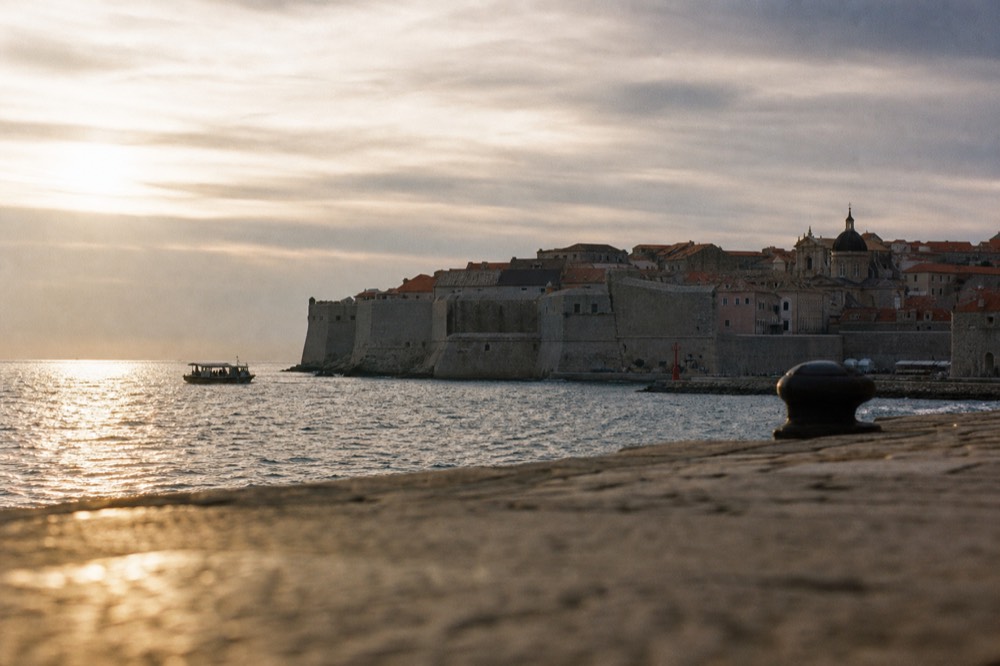 Dubrovnik city walls and terracotta rooftops under a grey winter sky