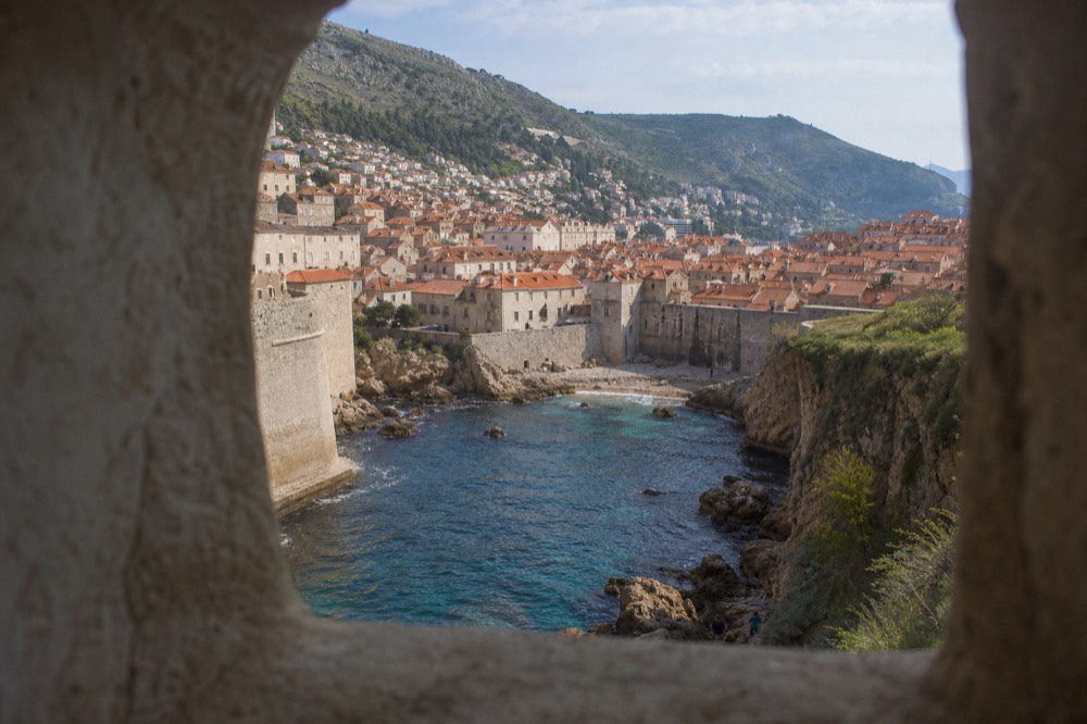Wide view of Dubrovnik Old Town rooftops and the Adriatic Sea from the city walls