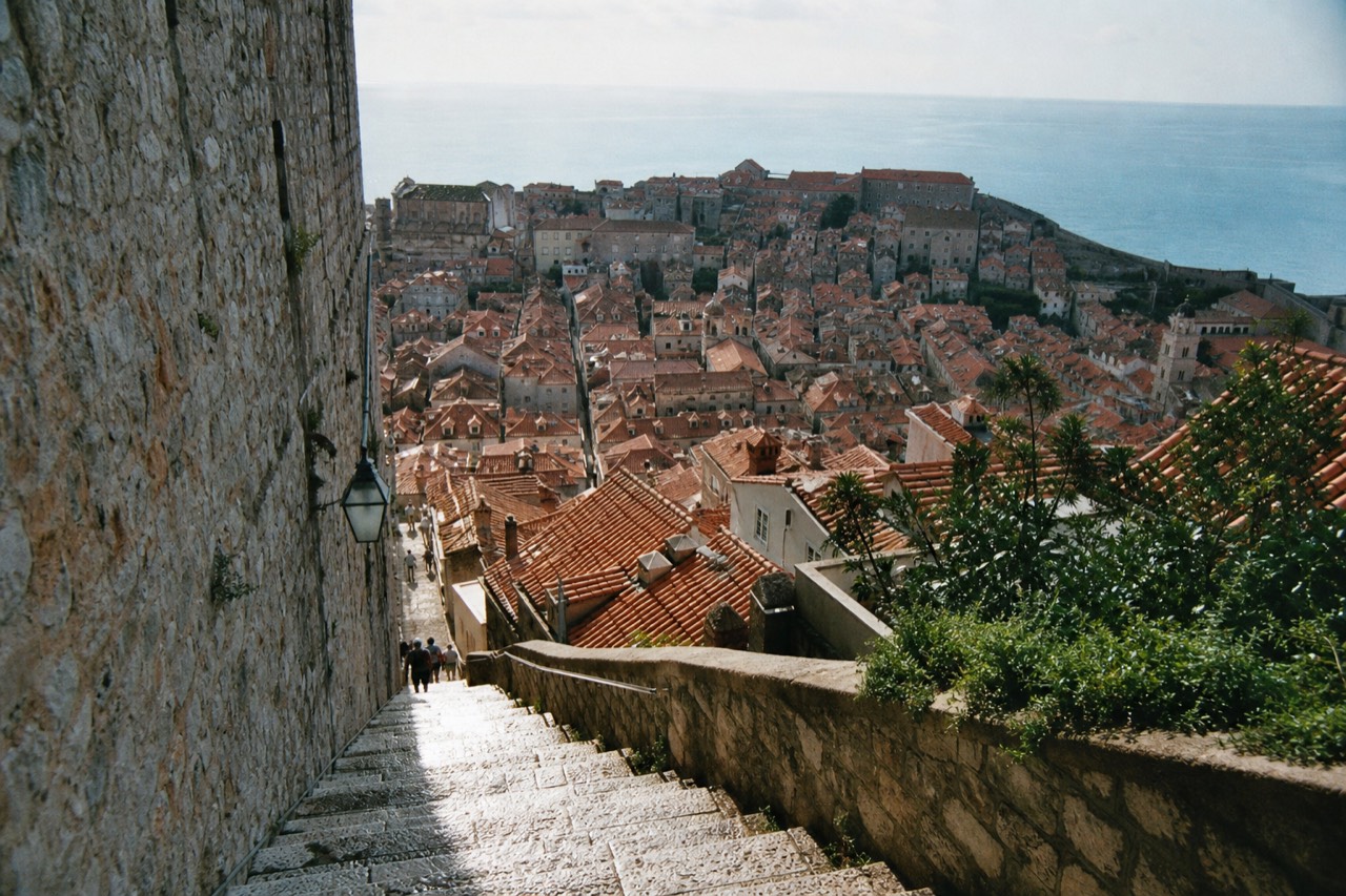 Dubrovnik's Old Town and red-roofed buildings seen from the city walls on a sunny day