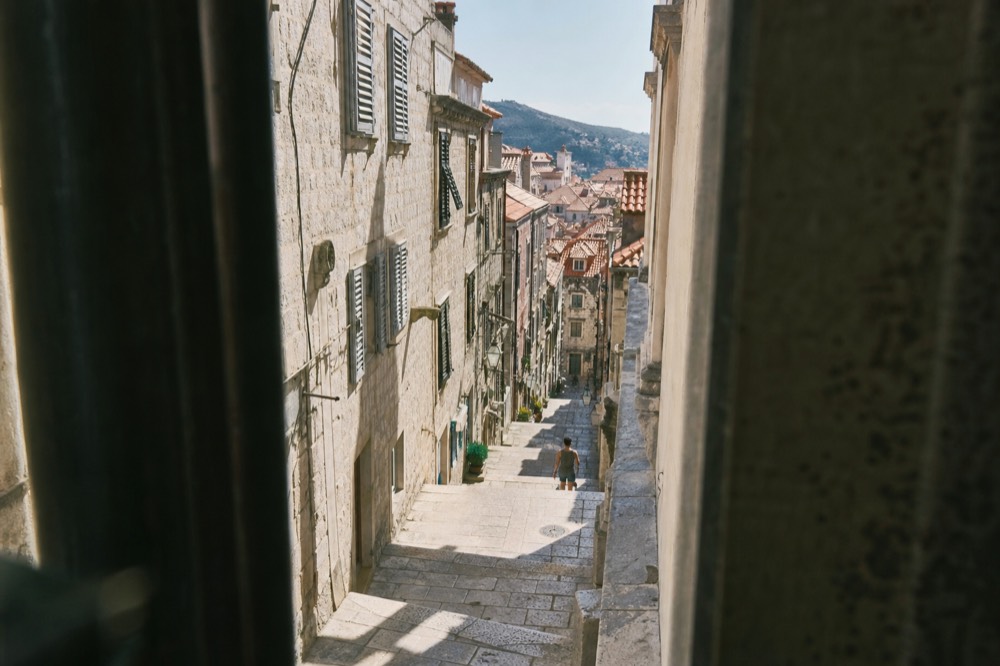 Baroque staircase in Dubrovnik Old Town lined with stone buildings