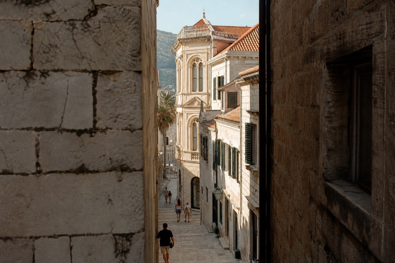 Limestone street in Dubrovnik Old Town with baroque buildings under afternoon light