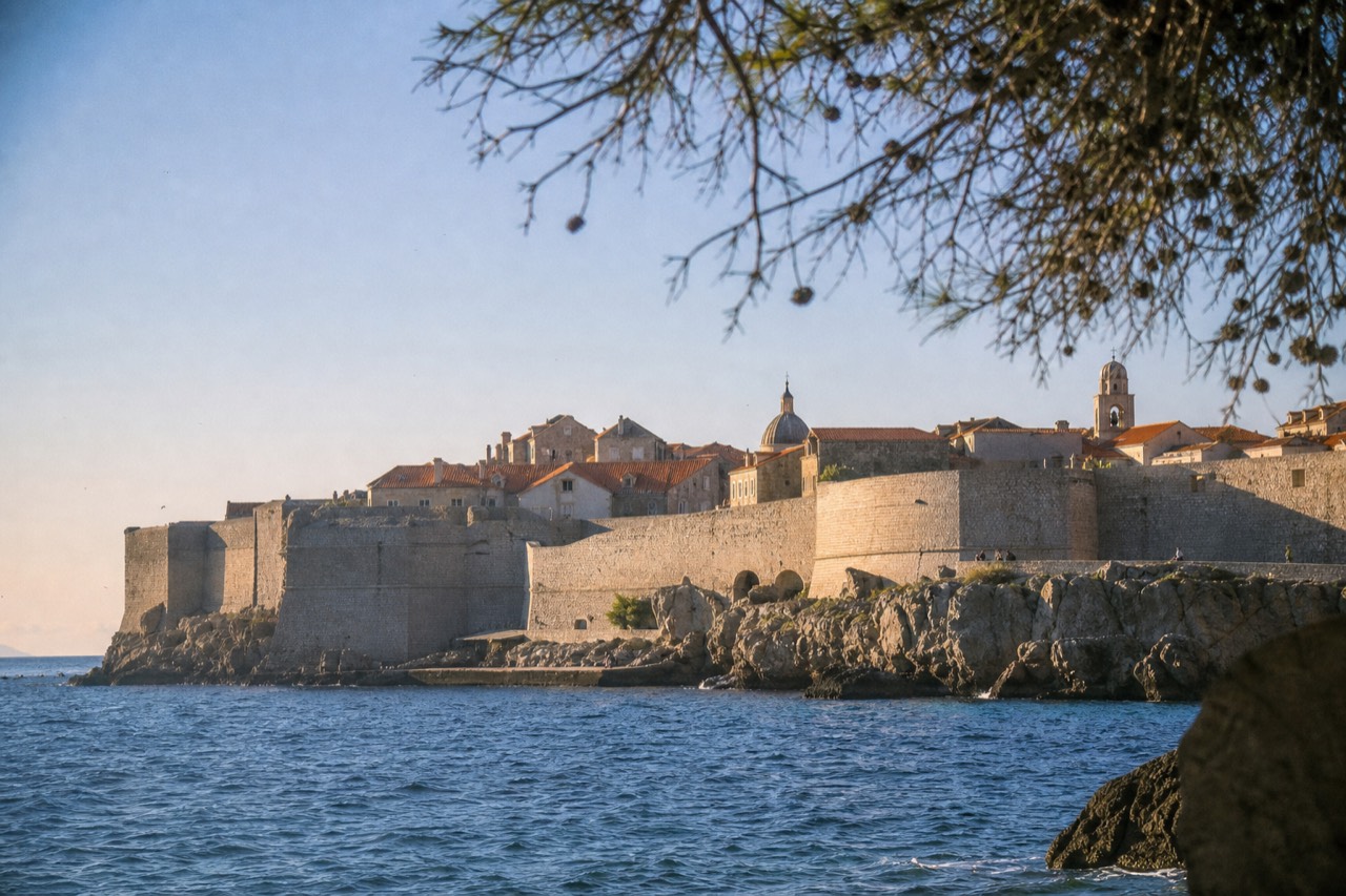 The walled Old Town of Dubrovnik seen from the Adriatic Sea on a bright morning