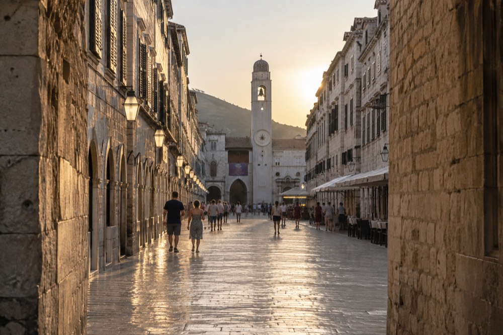 The limestone-paved Stradun street stretching toward the clock tower in Dubrovnik Old Town