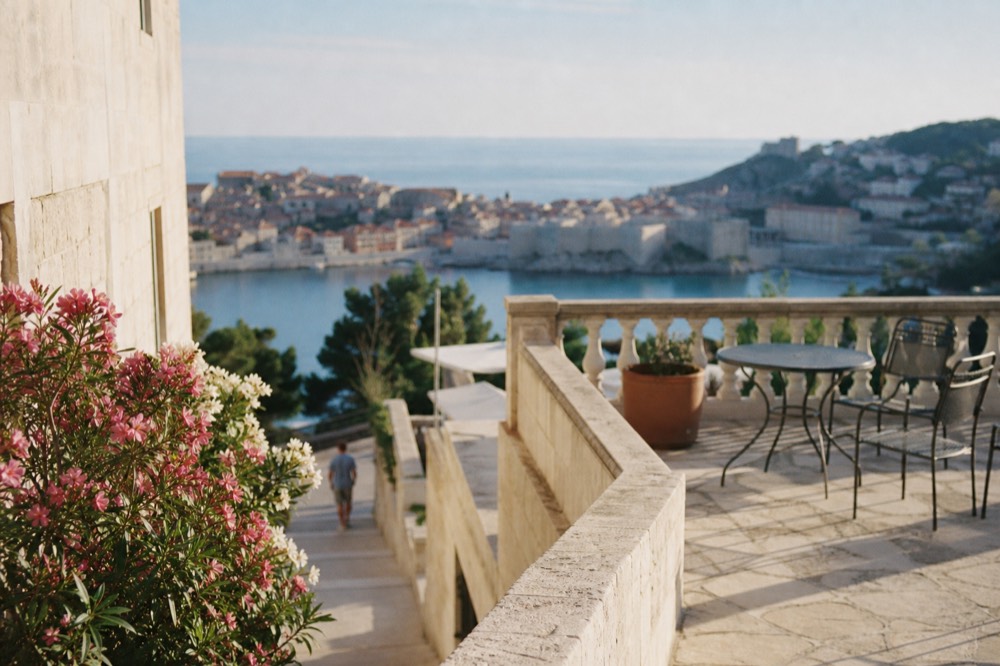 Hotel terrace overlooking the walled old town and the Adriatic sea