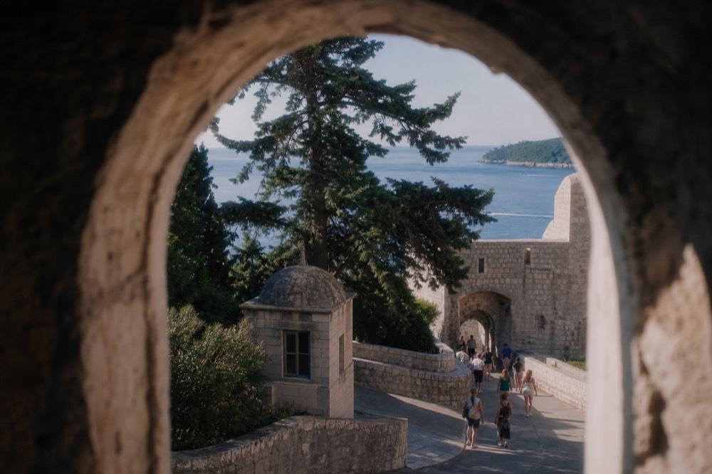 Ticket booth and stone entrance to the Dubrovnik city walls near Pile Gate