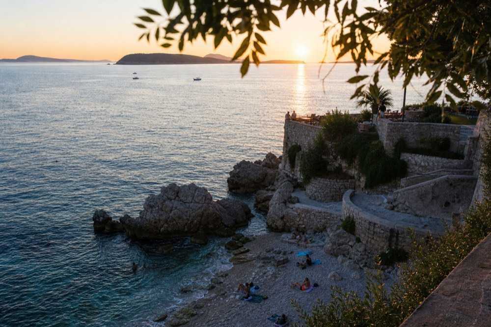 Sunset over the Adriatic from a Dubrovnik viewpoint with silhouetted islands on the horizon