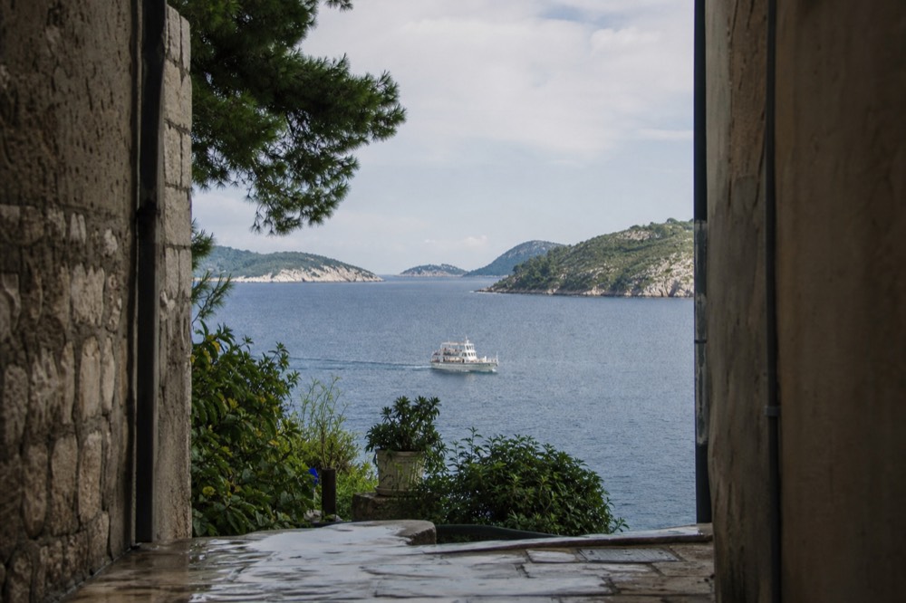 A calendar-style view of summer sea and islands from a boat