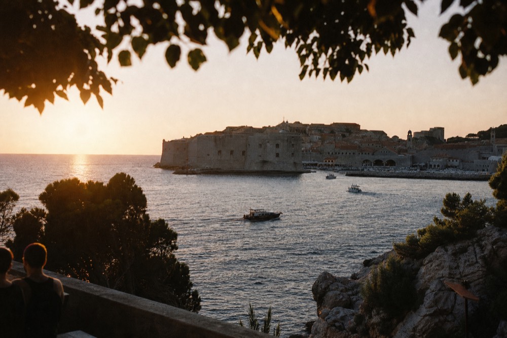 View of Dubrovnik city walls and towers from outside the fortifications at golden hour