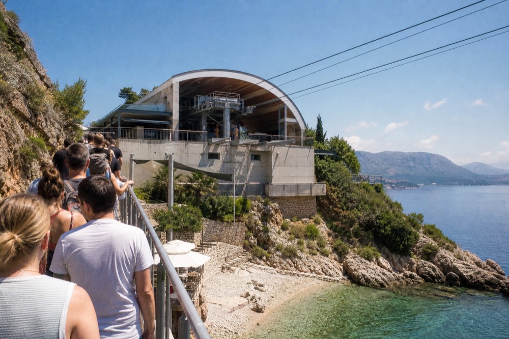Queue of visitors at the Dubrovnik cable car lower station in sunshine