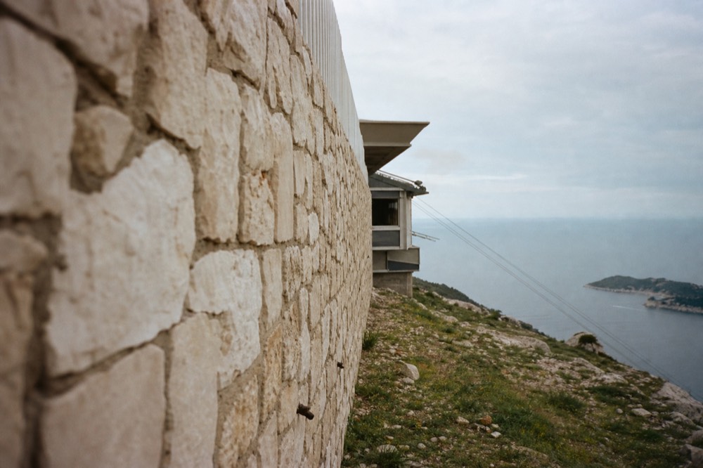Cable car upper station on Mount Srd with the Adriatic horizon beyond