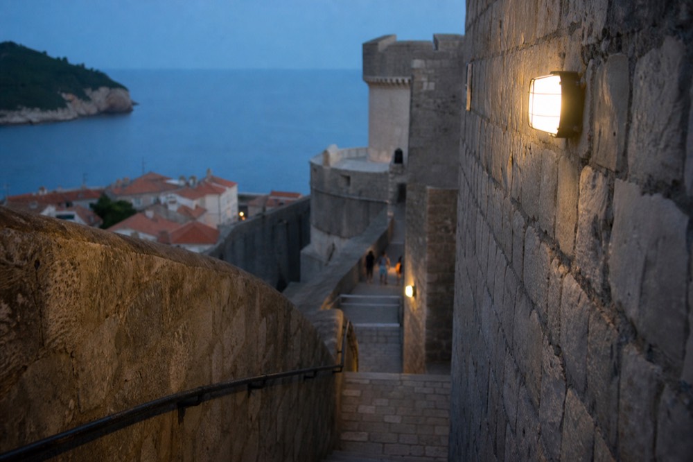 Steep stone staircase on the city walls between two towers