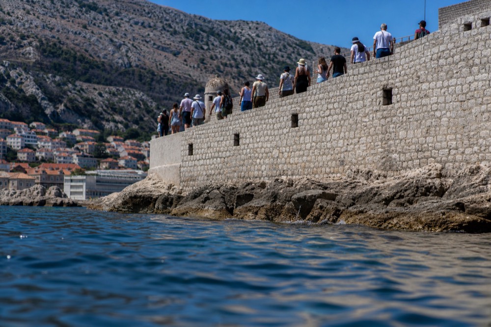 Tour group walking the city walls with a guide