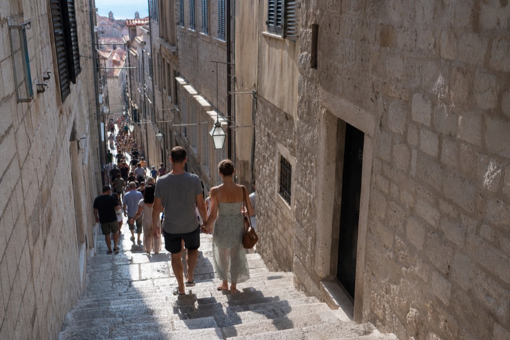 Crowded stone steps inside Dubrovnik Old Town in summer