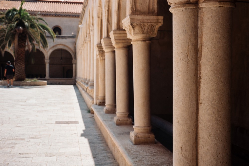 Cloister arcade of the Dominican Monastery with stone columns and arches
