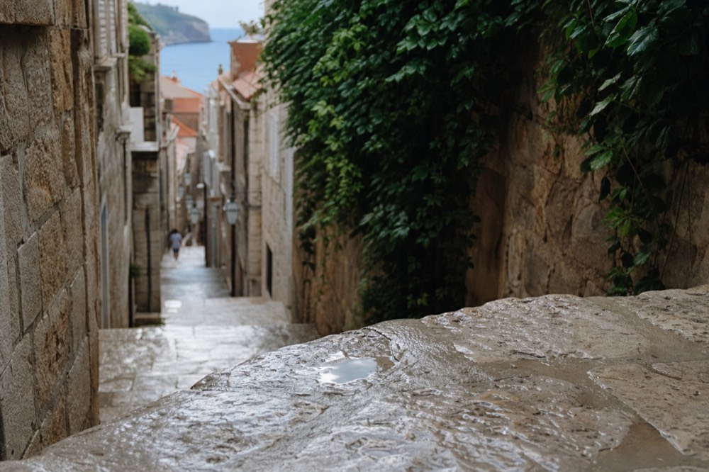 Narrow stone lane in Dubrovnik Old Town with worn steps