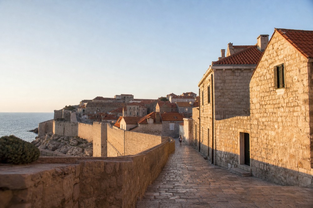 Empty stone street in the Old Town with sunlight on limestone paving