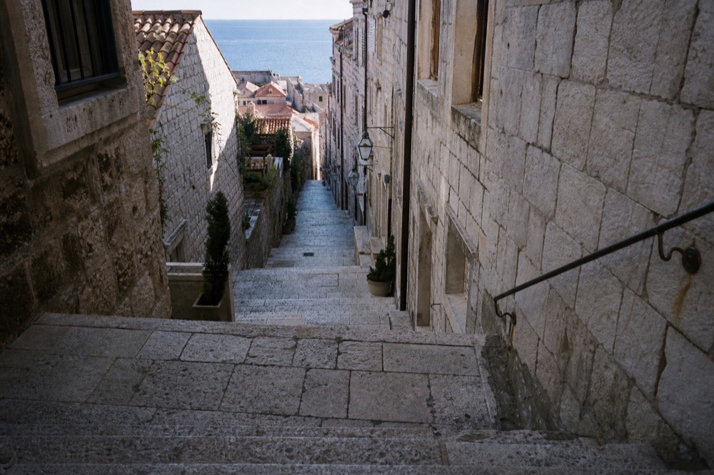 Empty stone street in Dubrovnik Old Town in soft autumn morning light