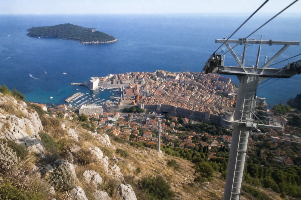 A view of the Old Town from the Srd cable car, with the island of Lokrum in the distance