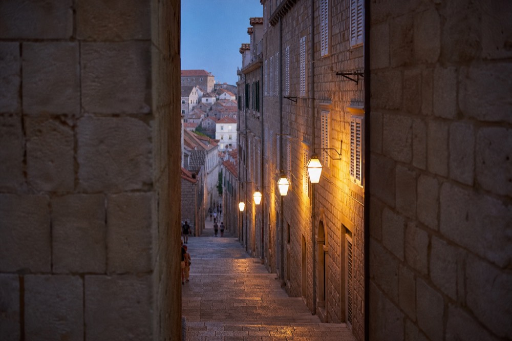 A limestone paved street in Dubrovnik Old Town lined with stone facades