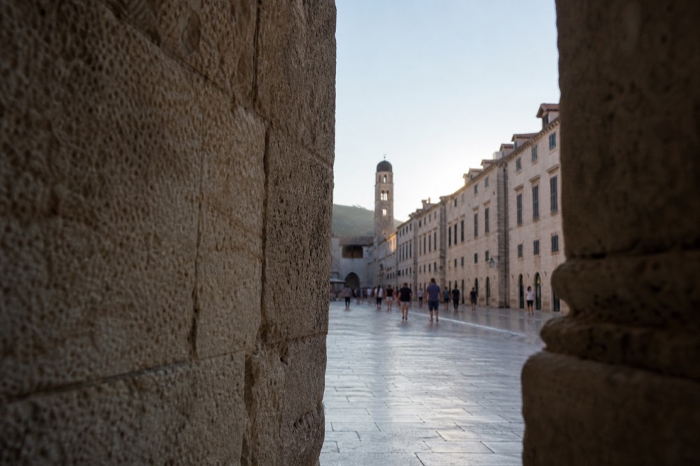 The Stradun in Dubrovnik Old Town, a wide limestone-paved street lined by stone buildings