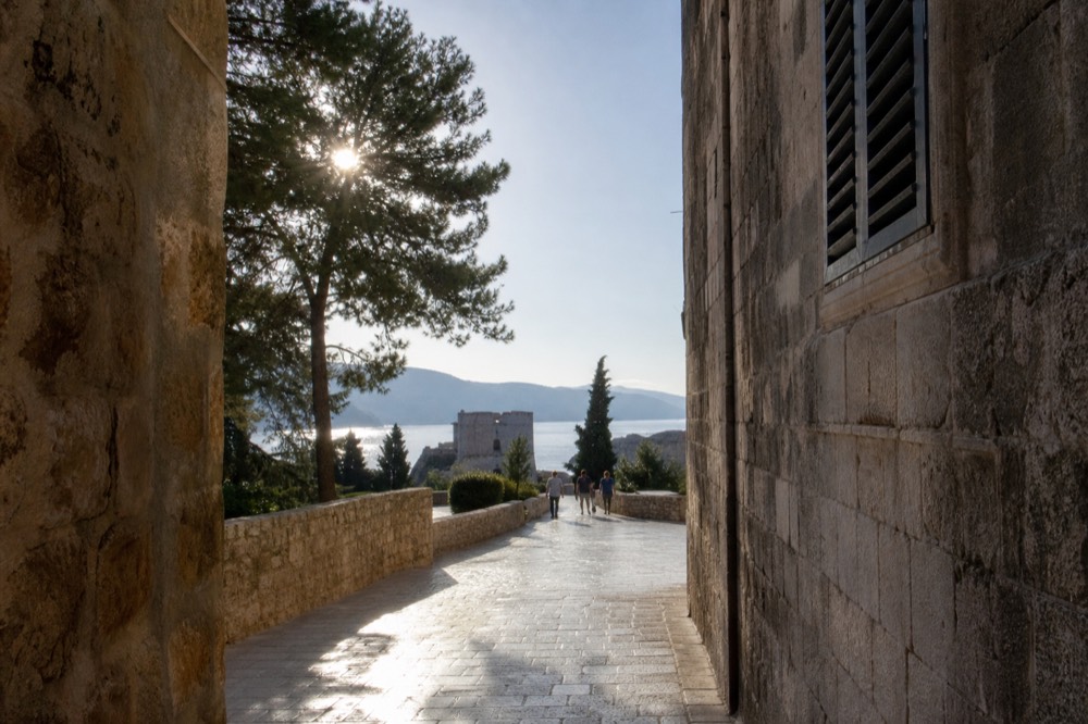 Wide limestone street in Dubrovnik Old Town polished smooth and gleaming under morning light