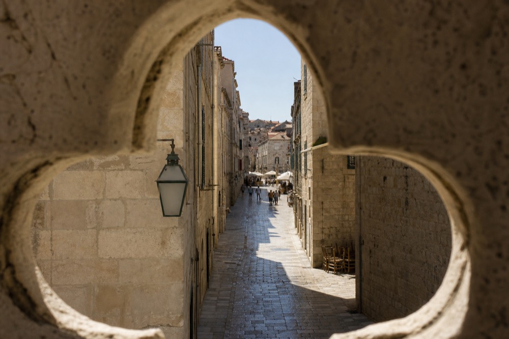 Polished limestone street in Dubrovnik Old Town shining in morning light