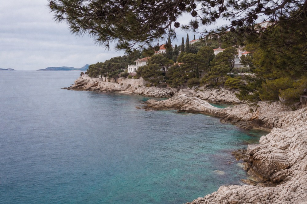 Clear turquoise water against rocky limestone coastline near Dubrovnik