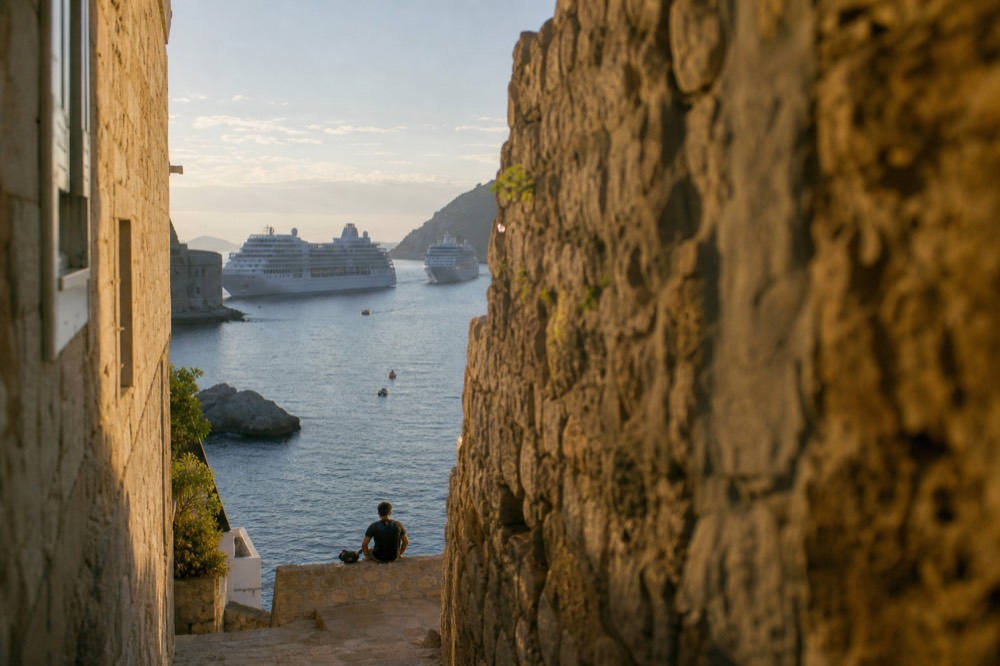 Cruise ships anchored off Dubrovnik Old Town in morning light