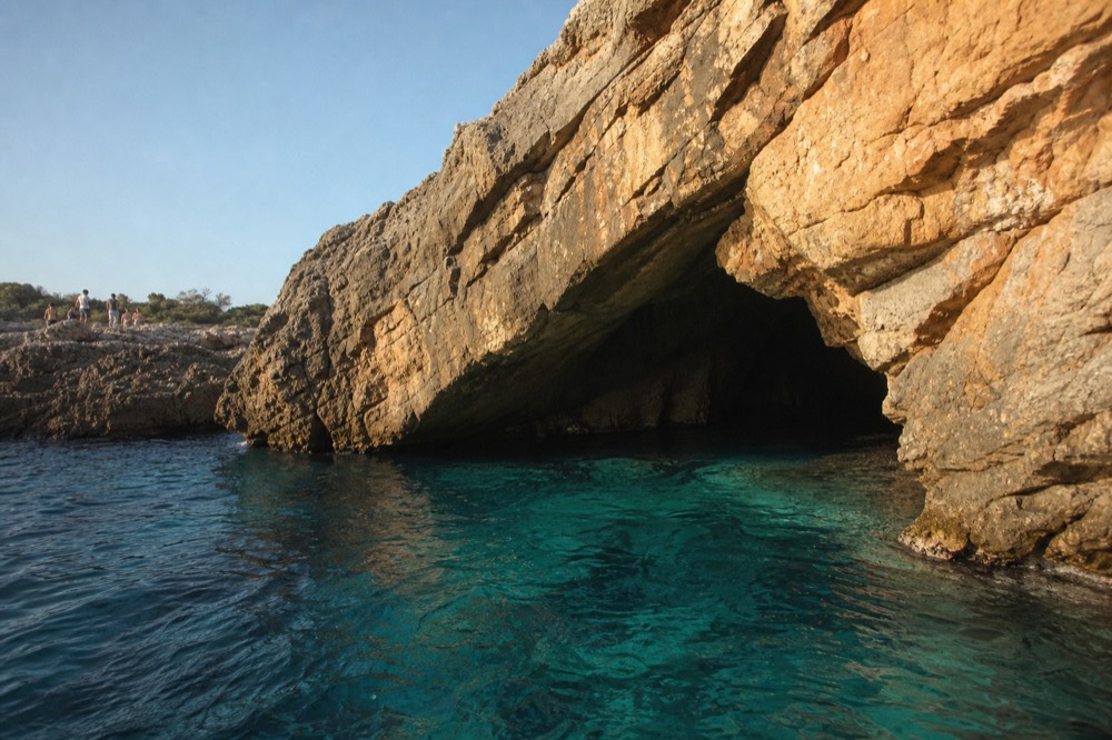 Clear turquoise water inside a sea cave near Lokrum island