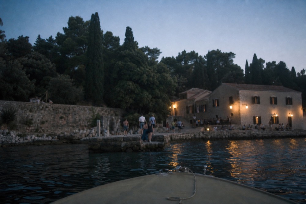 Small boat approaching the stone jetty on Lokrum island