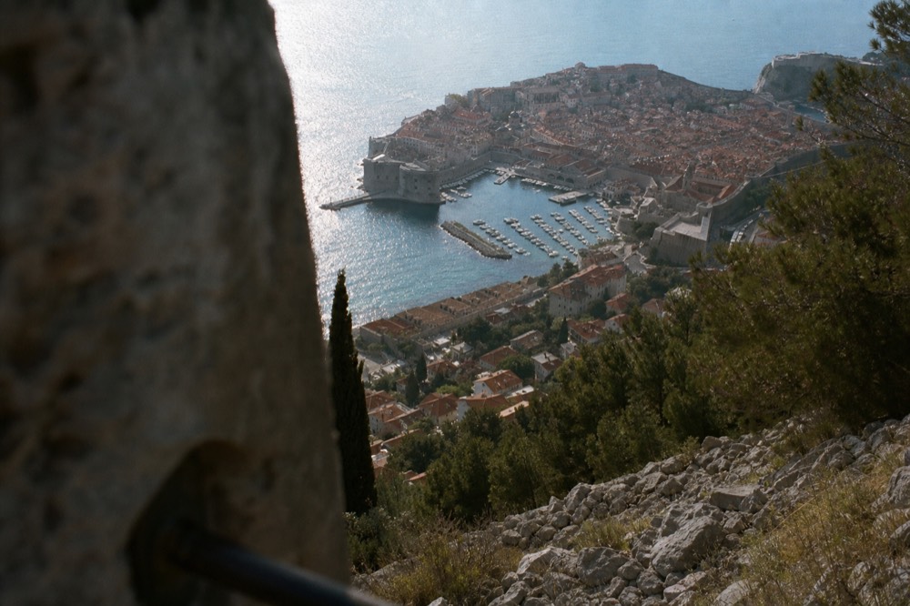 A view over orange rooftops and the Old Town harbour from the top of Minčeta Tower