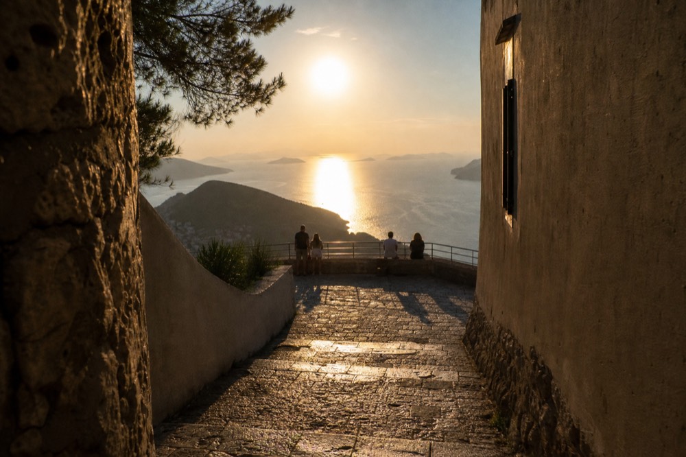 Sunset light over the Adriatic sea and distant islands seen from the viewing terraces on Mount Srd