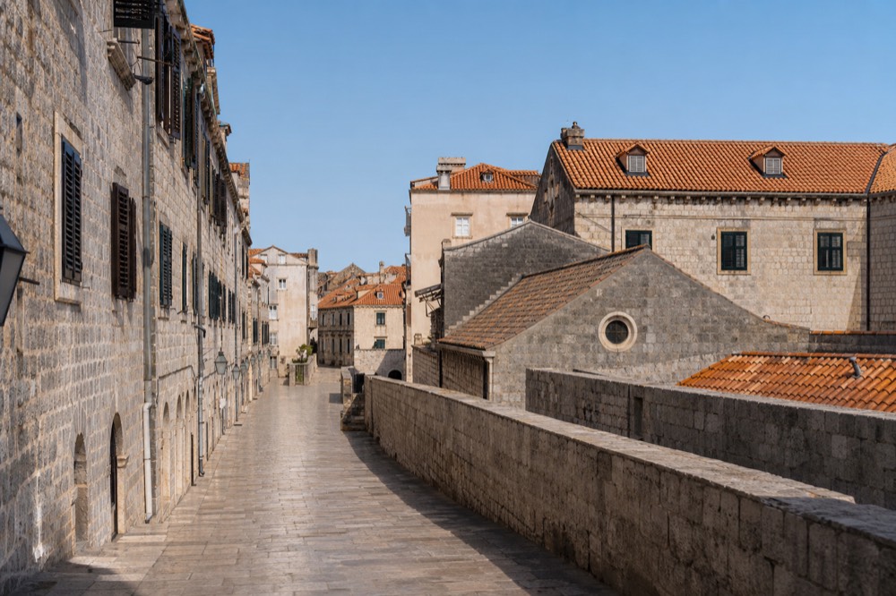 An empty limestone street in Dubrovnik Old Town in early morning light