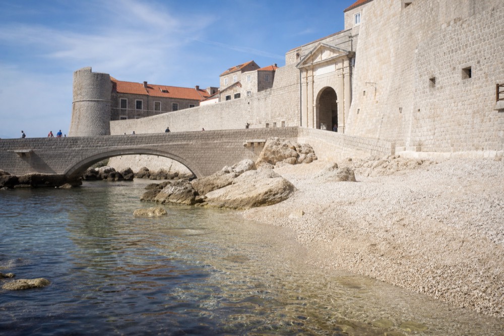 Stone bridge and arched gateway of Ploče Gate leading into the walled old town
