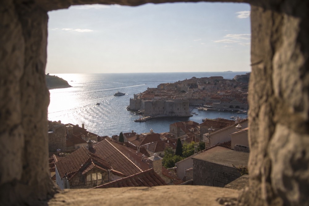 Stone buildings and terracotta rooftops of Dubrovnik seen from the city walls
