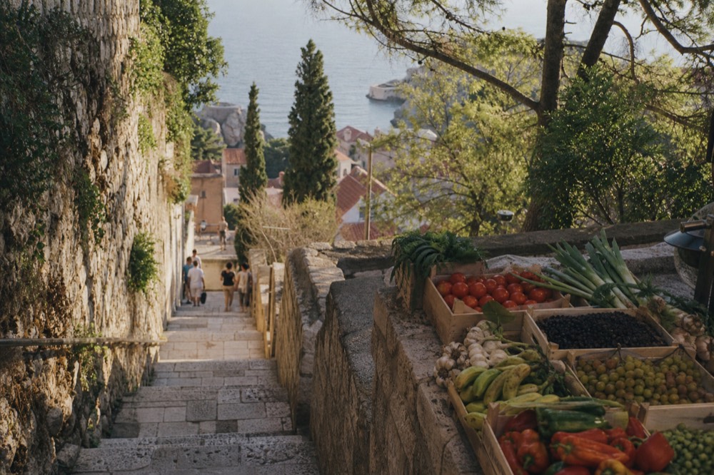 A market stall with fresh produce and olives in the morning