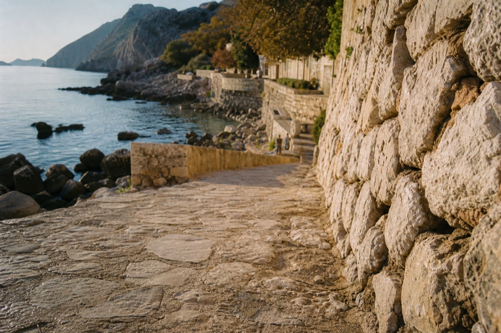 A calm rocky bay with clear water near Dubrovnik in autumn light