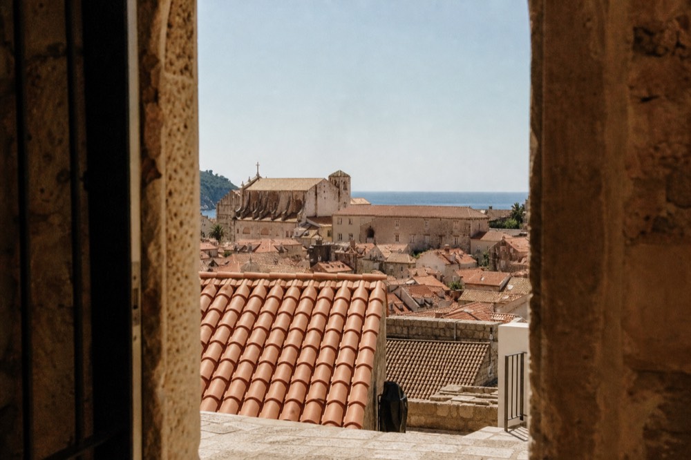 View over Dubrovnik Old Town rooftops toward the Adriatic Sea