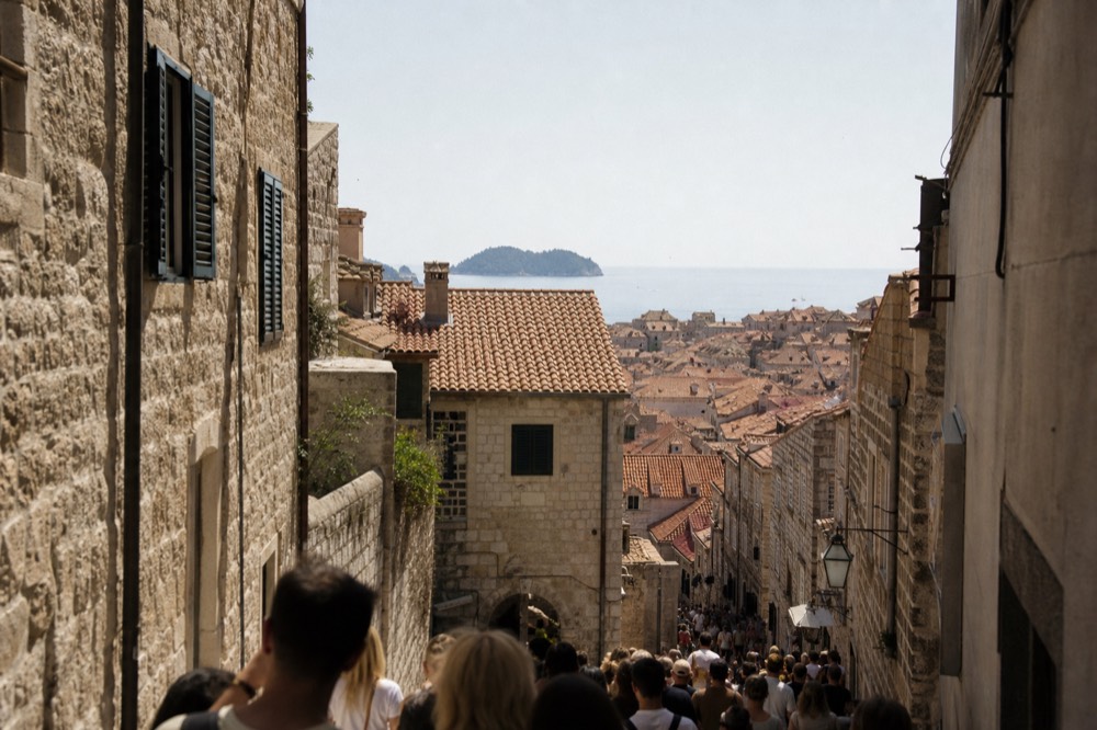 Crowded limestone street in Dubrovnik Old Town during daytime