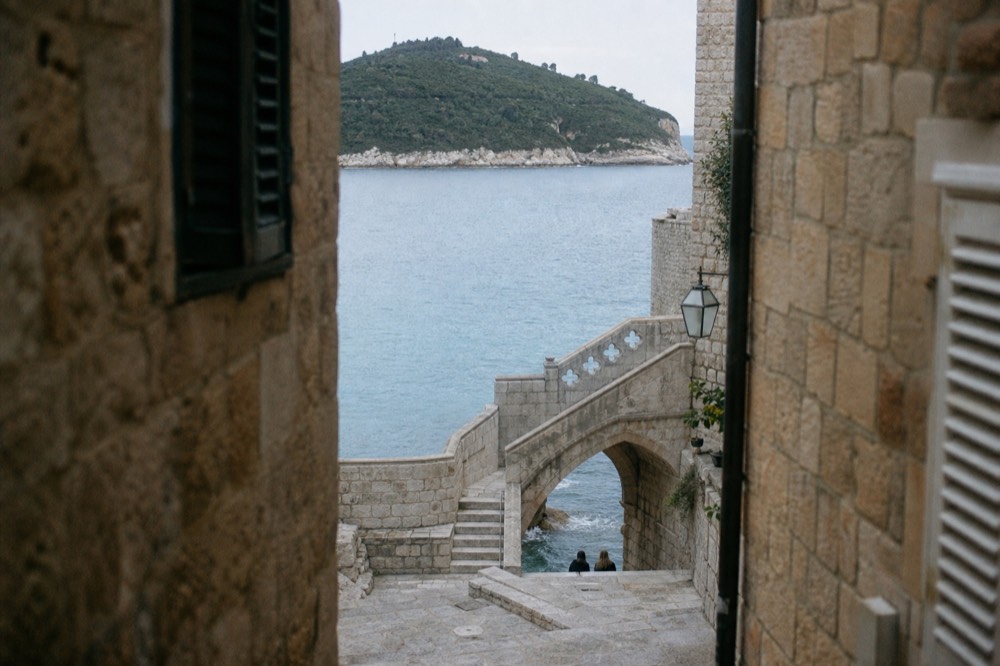A stone staircase and archway in Dubrovnik used as a filming location