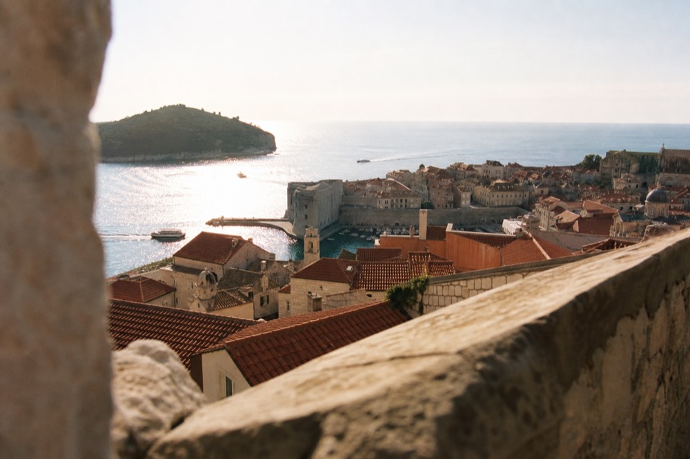 Red rooftops of the Old Town seen from the wall towers in late afternoon