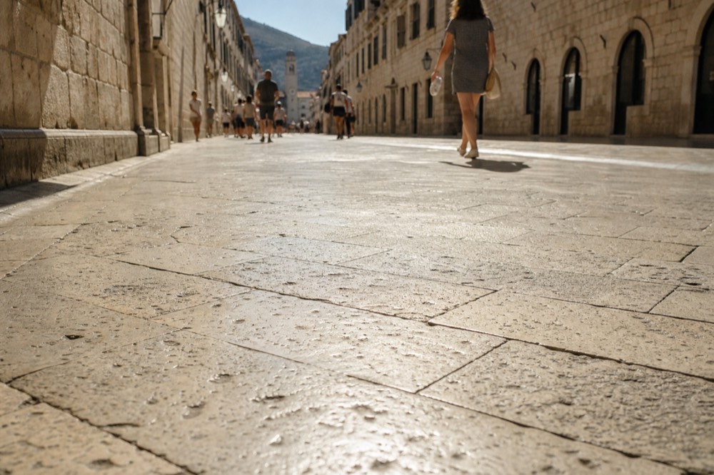 The main street of Dubrovnik's Old Town with limestone paving shining in morning light