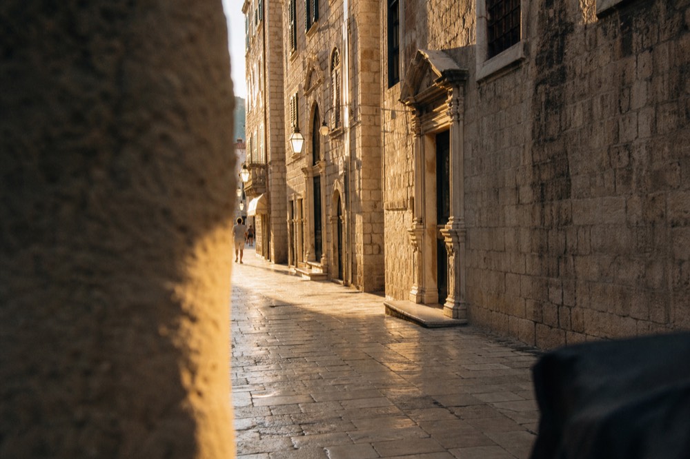 The main street of Dubrovnik's Old Town with limestone pavement and baroque facades in morning light